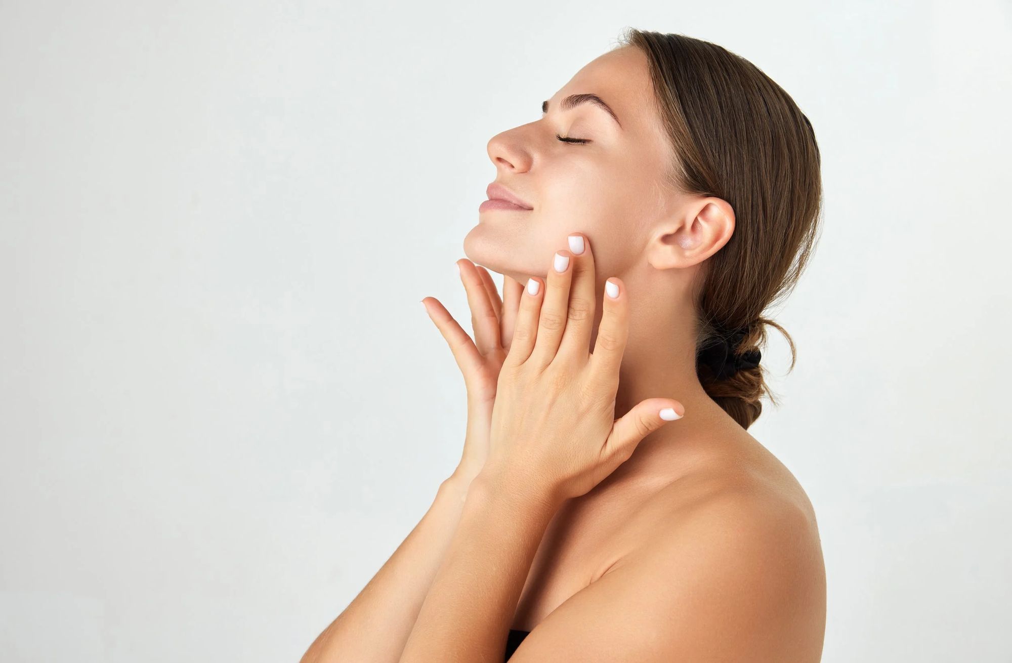 Calm portrait of a woman with clear, natural skin